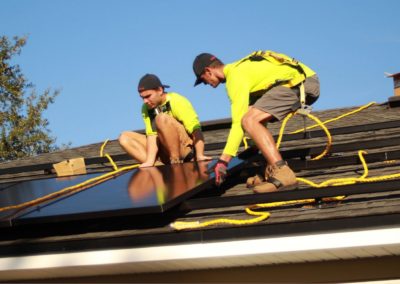 men working on a roof