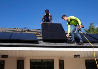 men on top of a roof